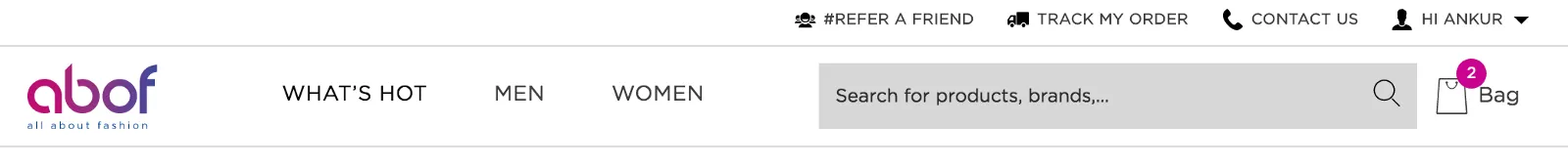 Screenshot of the top navigation bar on abof.com. In the first row there are links saying REFER A FRIEND, TRACK MY ORDER, CONTACT US, and an indicator for the currently logged in user. In the second row there&#x27;s a logo followed by three links: WHAT&#x27;S HOT, MEN, and WOMEN. After that there&#x27;s a search box and the shopping card indicator. The shopping card indicator has a badge on it with the number 2, indicating there are two items in the cart.